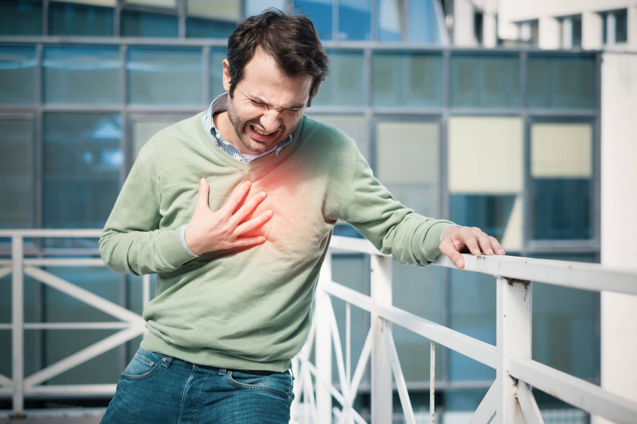 Man feeling a big pain on the chest and collapsing